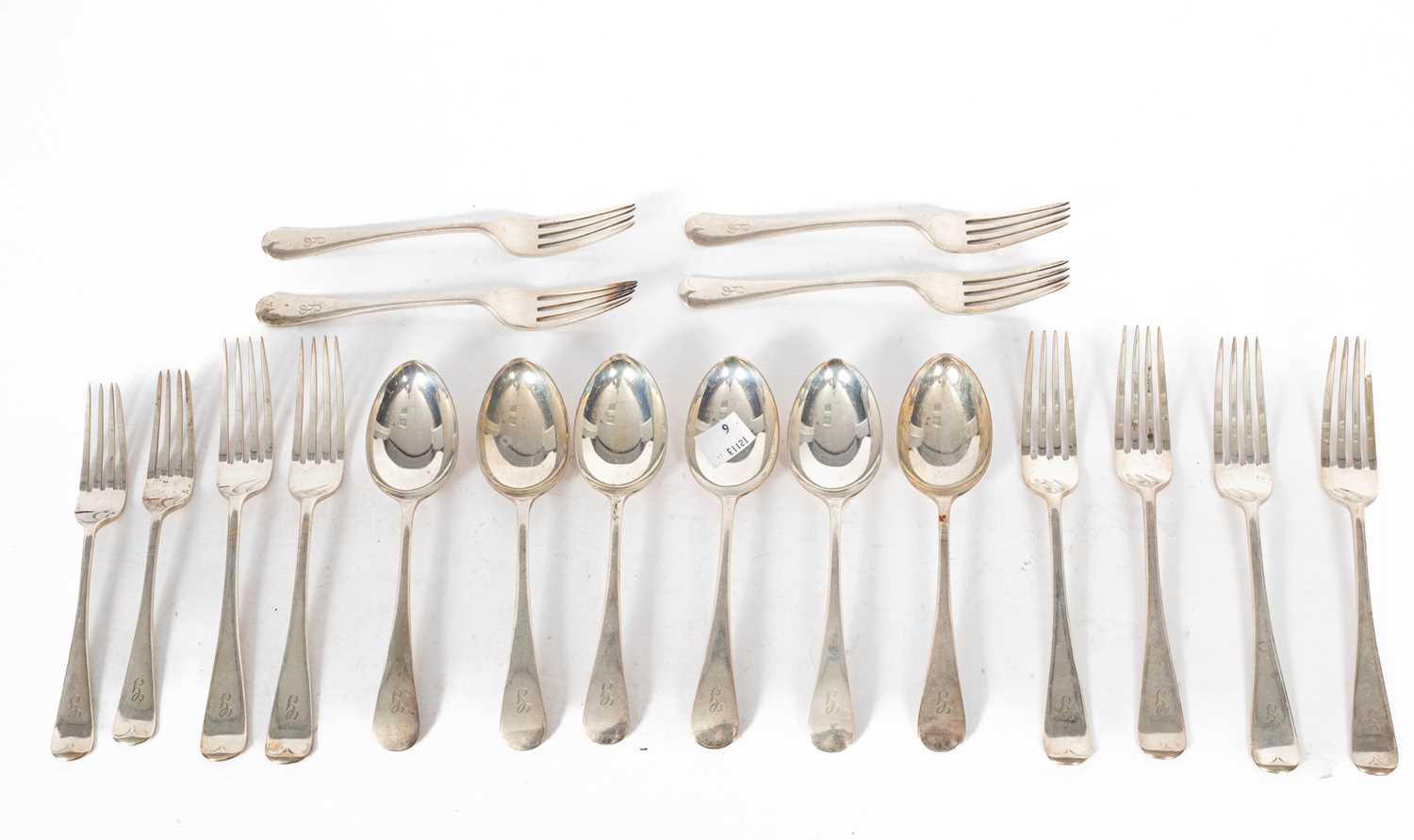 A set of six silver dessert spoons and forks