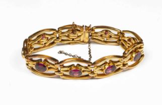 A gold and amethyst bracelet
