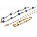 A 9ct gold chain link necklace set with lapis lazuli beads