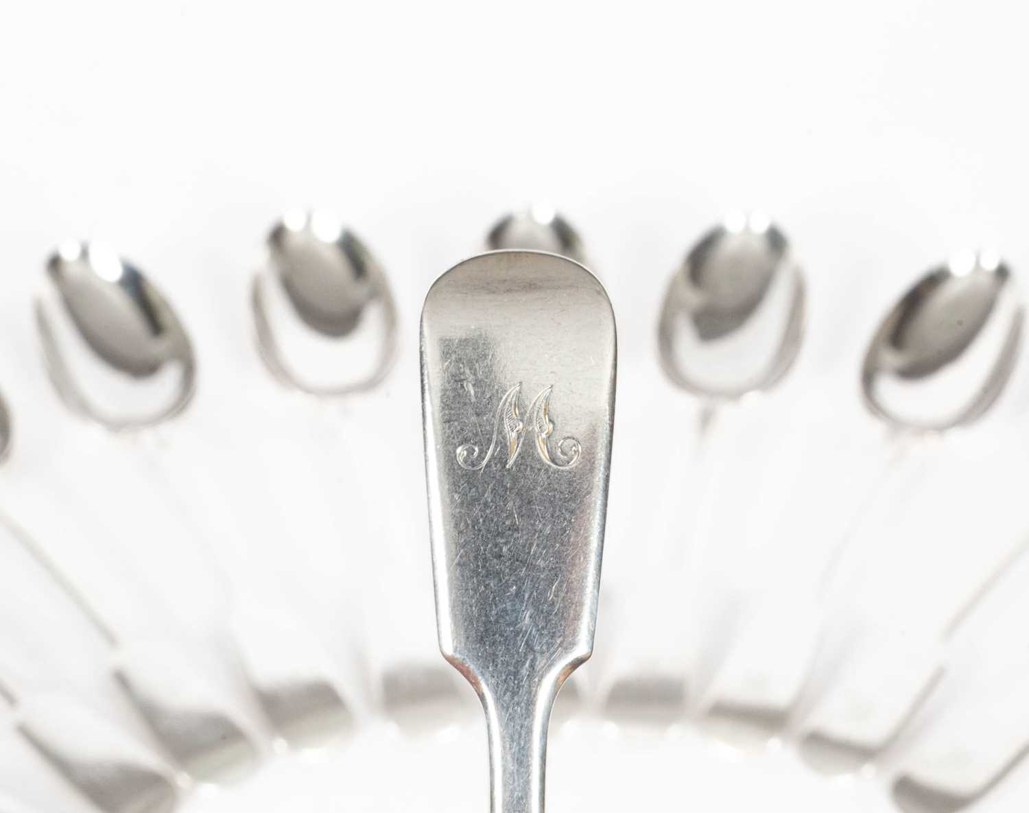 A set of eleven Victorian fiddle pattern silver dessert spoons - Image 2 of 5