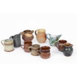 Various studio pottery jugs and mugs