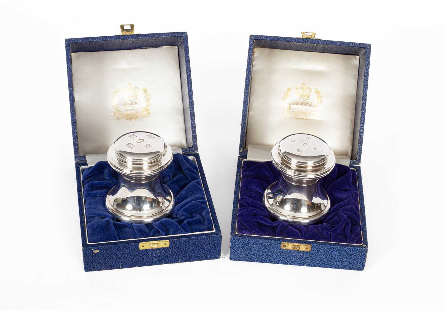 A pair of HM Queen Elizabeth II Silver Jubilee silver mounted paperweights