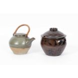 A large stoneware teapot