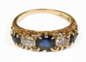 A gold diamond and sapphire five-stone ring