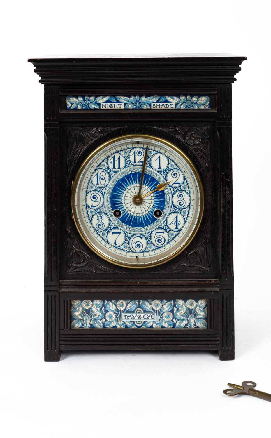 Lewis Foreman Day (1845-1910) An Arts and Crafts porcelain mounted ebonised mantel clock