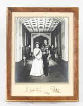 A signed black and white photograph of HM Queen Elizabeth II and HRH Prince Philip dated 1976