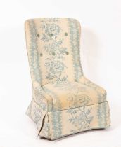 A beech framed button back nursing chair