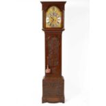 An eight-day oak longcase clock