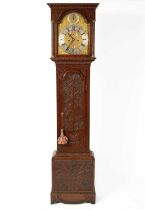 An eight-day oak longcase clock