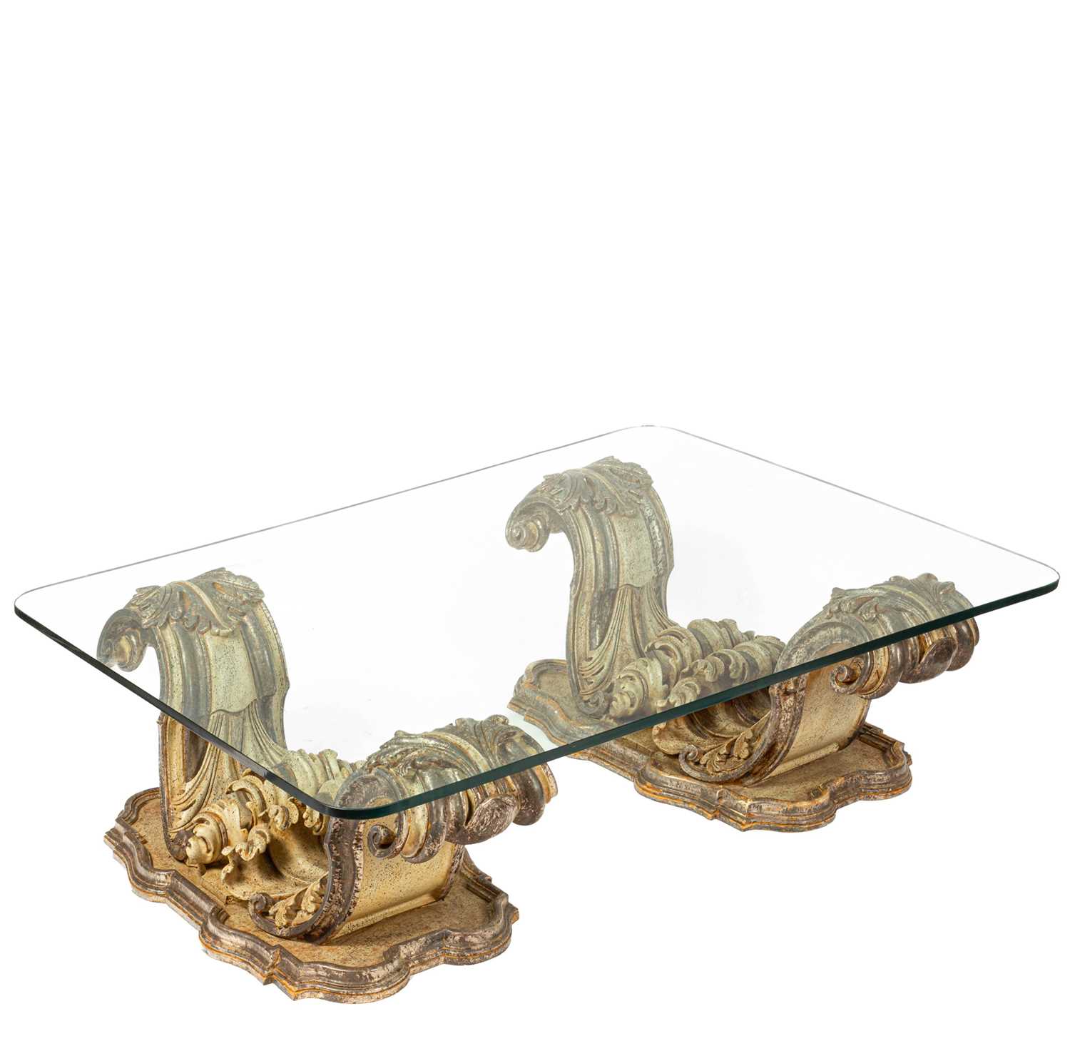 A Baroque inspired glass top coffee table