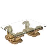 A Baroque inspired glass top coffee table