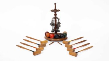 A late Victorian mahogany table croquet set