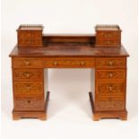 An Edwardian mahogany inlaid kneehole writing desk
