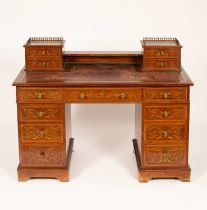 An Edwardian mahogany inlaid kneehole writing desk