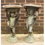 A pair of lead cherub figures