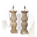 A pair of reconstituted stone table lamps