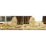 A pair of stone recumbent lions