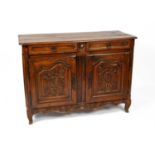 A French fruitwood and oak buffet