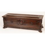 A 17th Century Italian walnut carved and panelled cassone