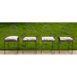 A set of four iron garden chairs of Gothic style