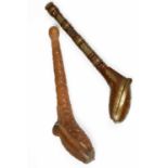 Two wooden carved pipe holders,