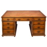 An oak pedestal desk