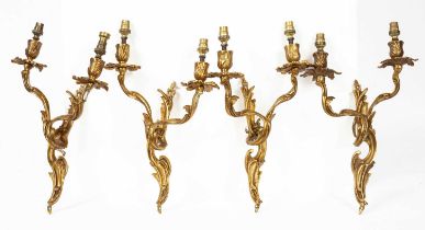 A set of four Rococo style two branch wall lights