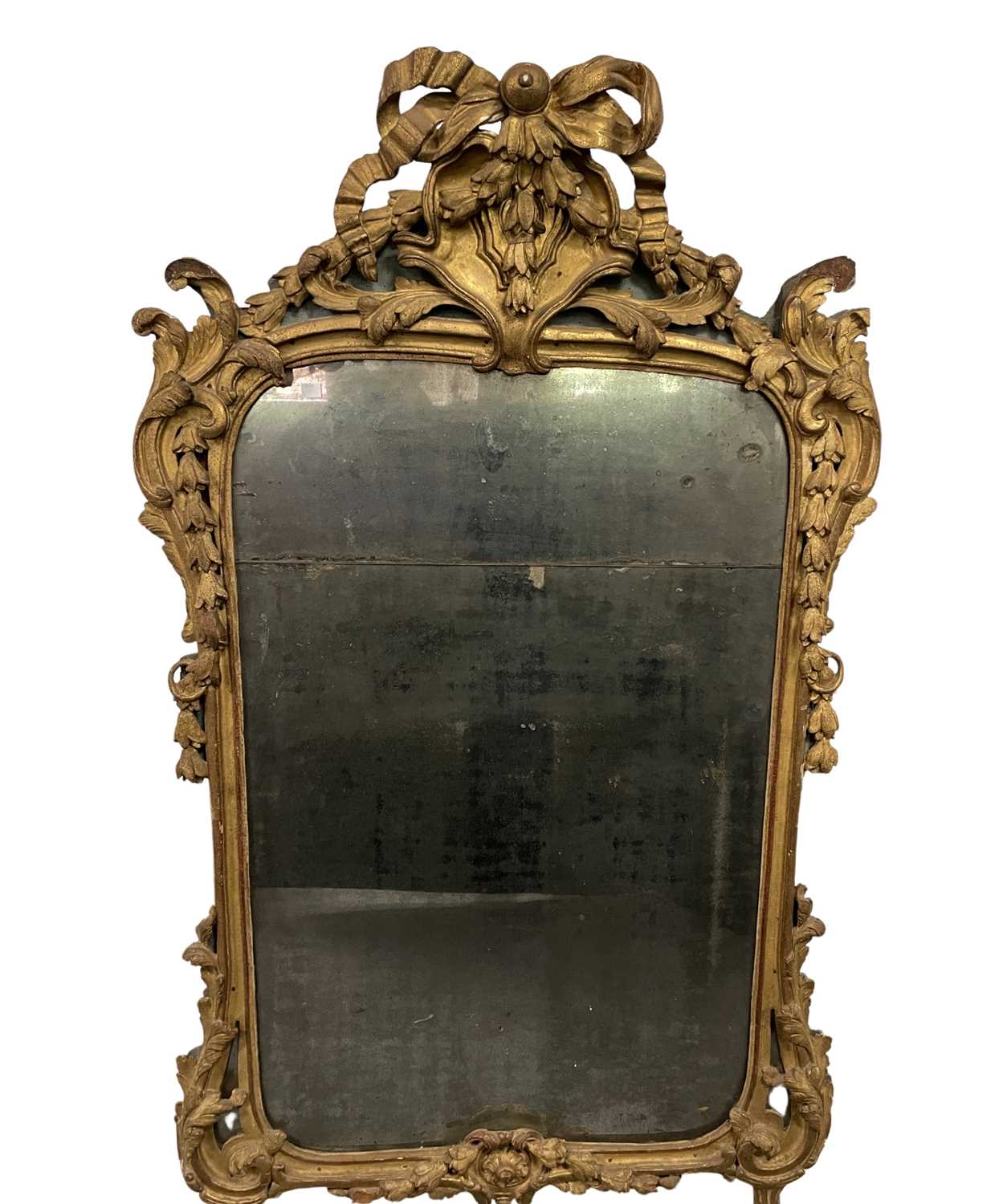 A gilt carved overmantel mirror