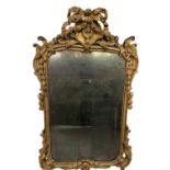 A gilt carved overmantel mirror