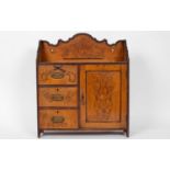 An early 20th Century smoking cabinet