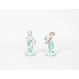 A pair of Continental porcelain figures of children playing leap frog