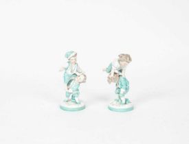 A pair of Continental porcelain figures of children playing leap frog