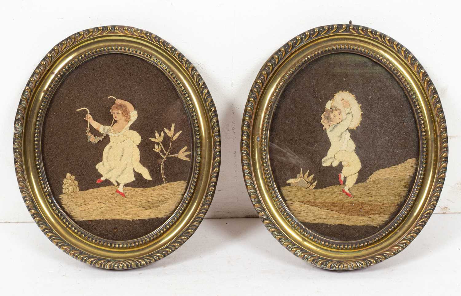 A pair of 19th Century needlework and watercolour pictures