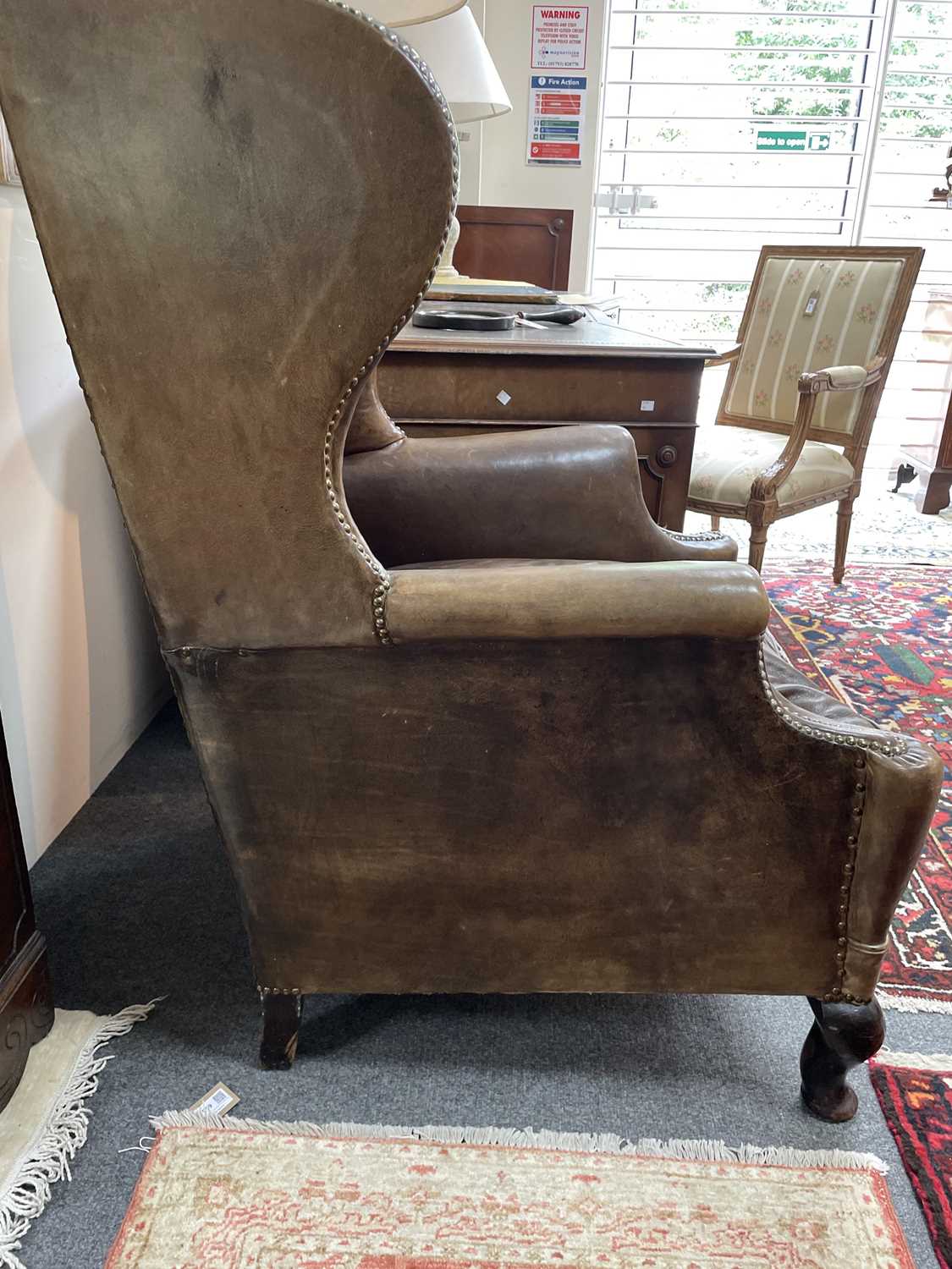 An early 20th Century leather wingback chair - Image 16 of 17