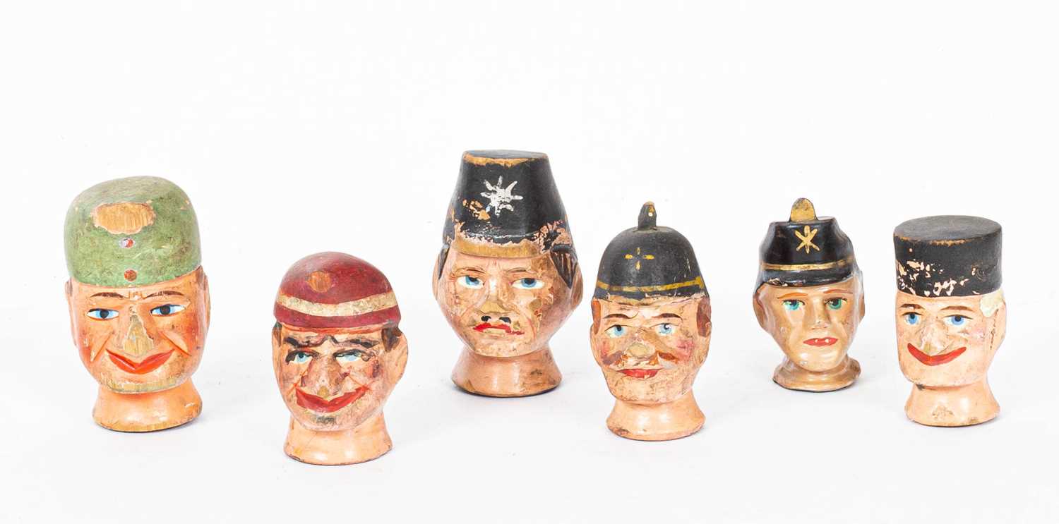Six Austrian painted and decorated carved wood puppet heads
