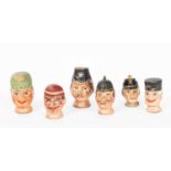 Six Austrian painted and decorated carved wood puppet heads