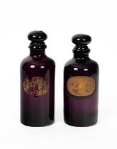 A pair of 19th Century amethyst glass apothecary’s bottles and stoppers