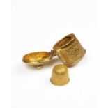 A gilt metal thimble case and thimble for a chatelaine,