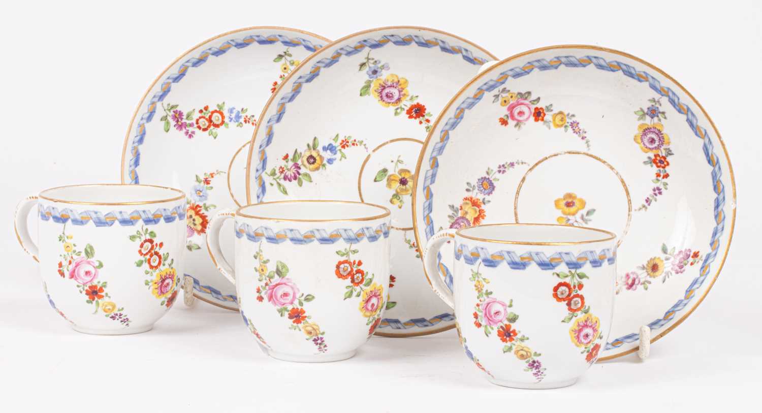 Three Meissen cups and saucers