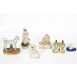 Four Staffordshire figures of dogs