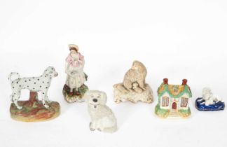 Four Staffordshire figures of dogs