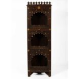 A North African carved corner cupboard