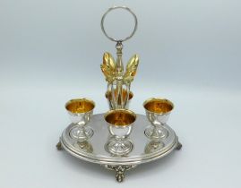 A four setting silver plated WMF egg cup & spoon s