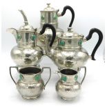 A five piece Ashberry Arts & Crafts hammered pewter tea & coffee set with Ruskin roundels, largest p