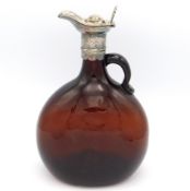 A 19thC. brown glass decanter with decorative whit