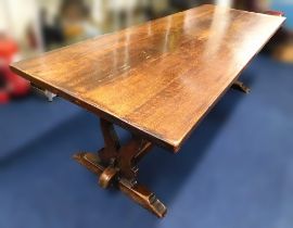 A large oak topped refectory table with elm base,