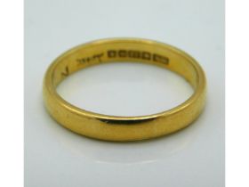 A 22ct gold band, 3.4g, size N/O