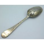 An early 18thC. silver rat tailed tablespoon, probably London, bearing stag mark, other marks rubbed