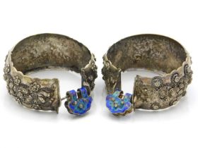 A pair of decorative antique white metal bangles w