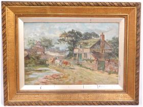 An antique framed oil on canvas depicting cattle o